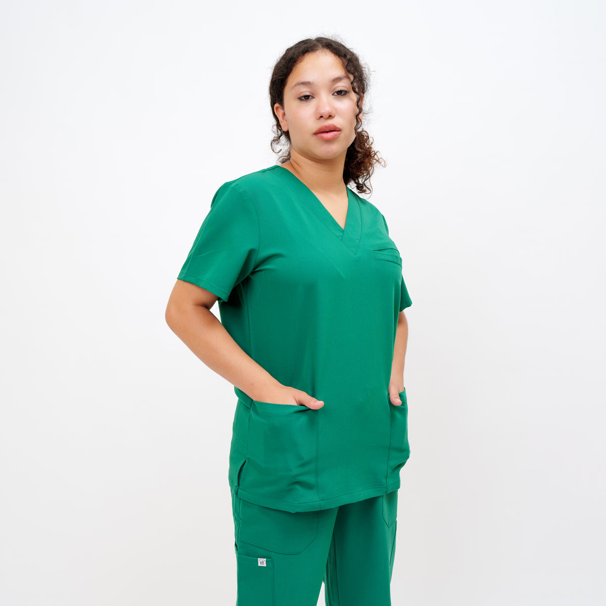 Women's V-Neck Double Pocket Top in Emerald Green