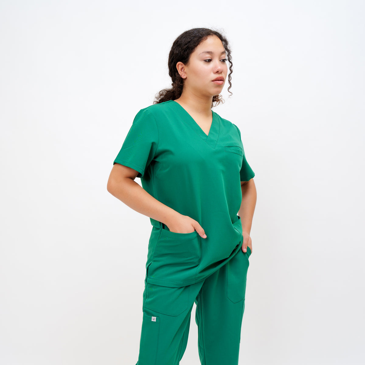 Women's V-Neck Double Pocket Top in Emerald Green